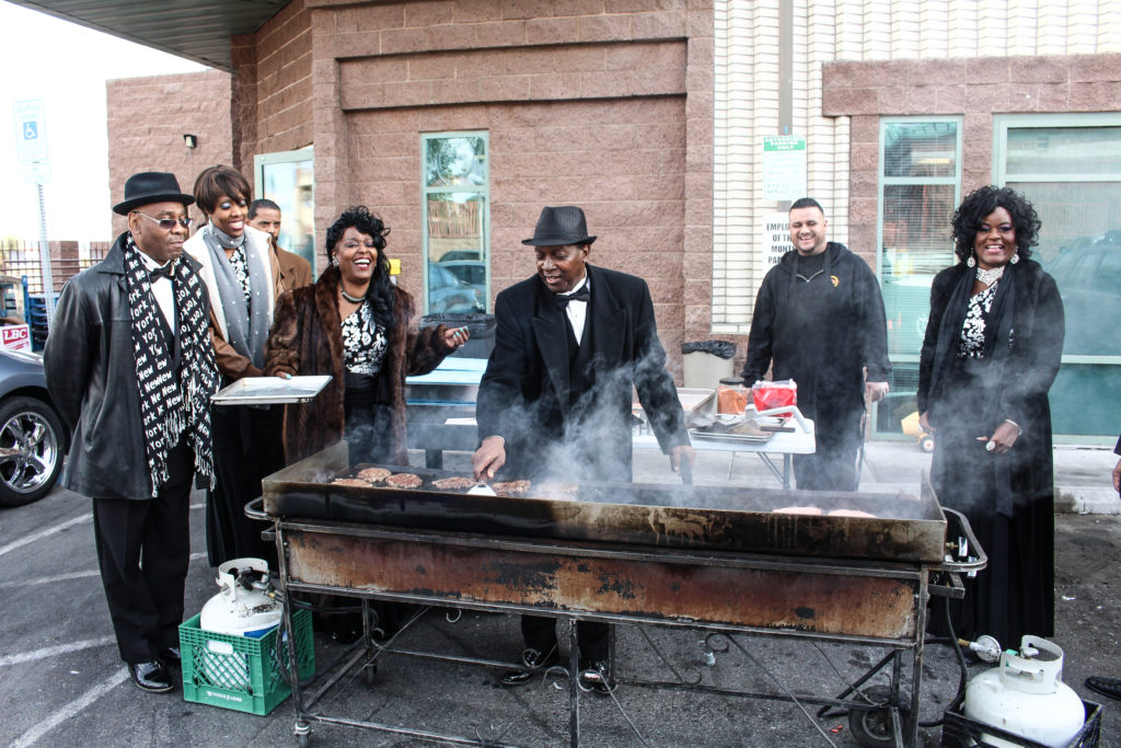 Forever Doo Wop and Early Clover performers flip burgers and entertain at the 3rd annual Shade Tree holiday event.